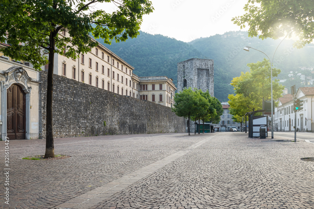 Como city, historic center, lake Como, Italy. Scenic view of the old walls with the medieval tower called of San Vitale (viale Battisti). Itinerary and travel destination in northern Italy 