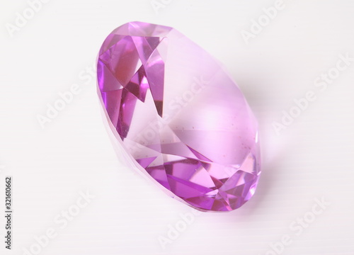 purple diamond on white surface