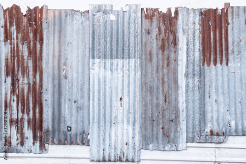 Tableau sur toile Rusty corrugated galvanized steel wall or iron metal sheet surface for texture and background