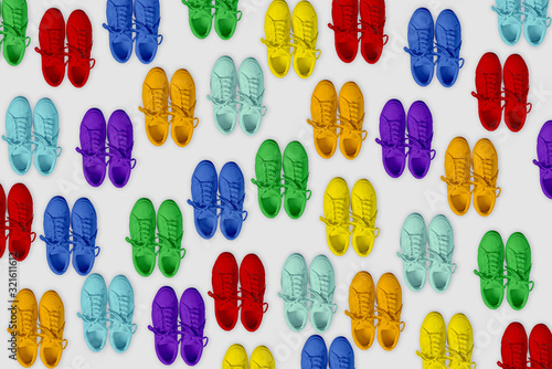 Short low brigt sneakers on a gray background. Rainbow. Pattern 