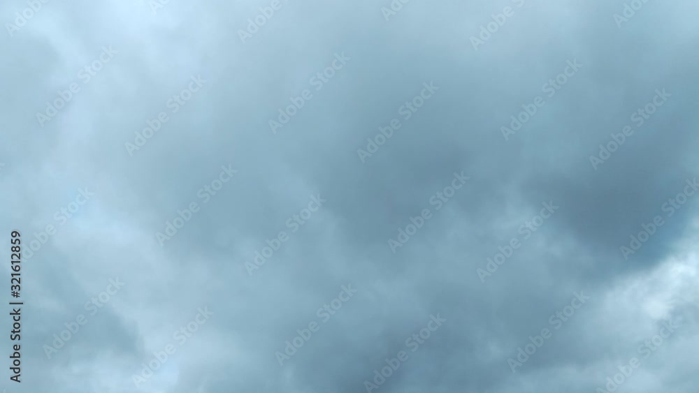 Clouds flying through the winter sky. Snow-carrying clouds driven by the wind through the cold winter sky. Clouds flying through the winter sky. Snow-carrying clouds driven by the wind through the cold winter sky.