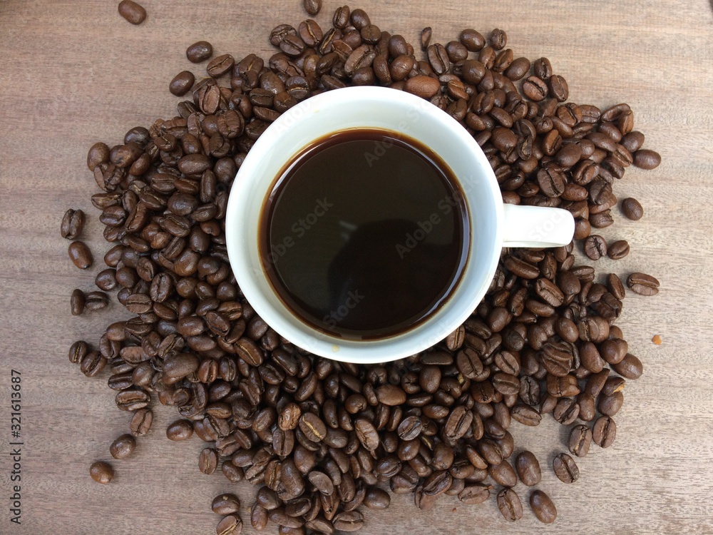 coffee beans on wooden background coffee beans on wooden background