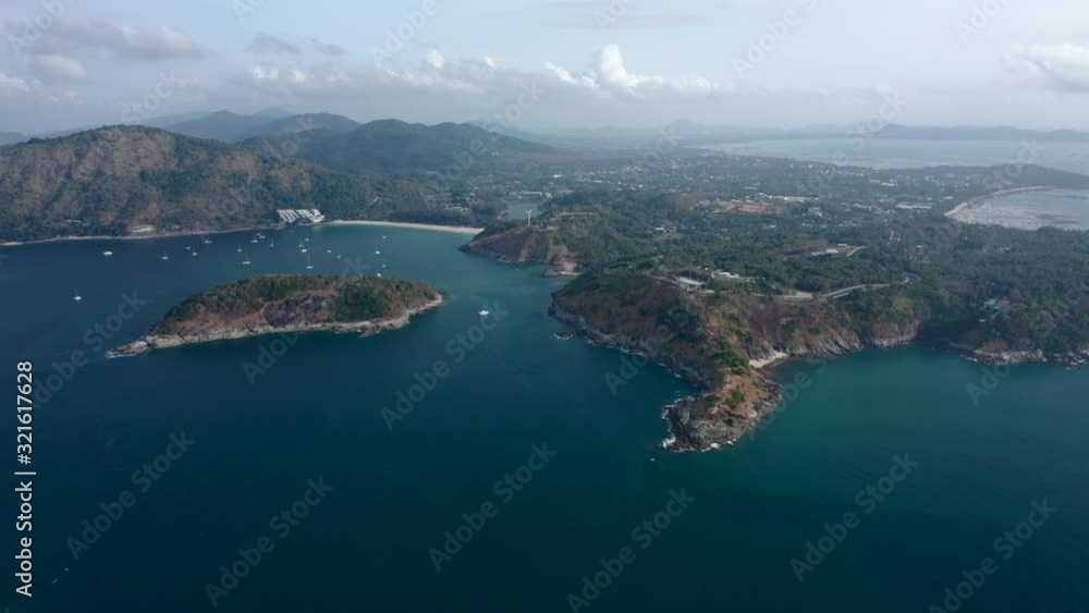 Aerial view of the Promthep Cape on the south of Phuket island in Thailand. Orbiting around southernmost tip of Phuket island. Aerial view of the Promthep Cape on the south of Phuket island in Thailand. Orbiting around southernmost tip of Phuket island.