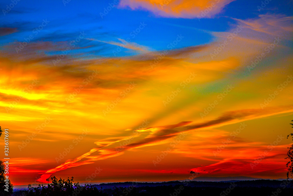 Fototapeta premium Vapour Trails at Sunset over Melbourne