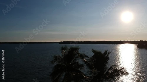 Beautiful sunset,Vembanad lake ,sky aerial view,Sun set,aerial shot,Waves,coconut trees , photo