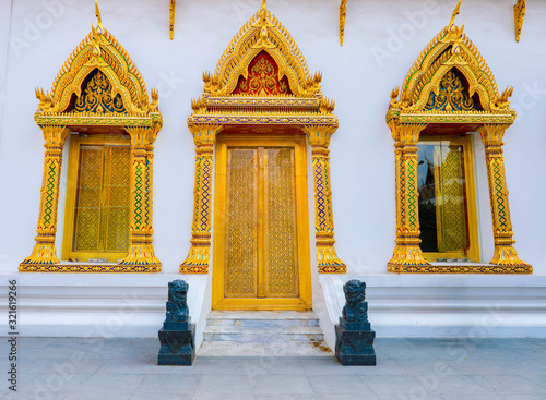 Architecture of windows and elaborately decorated pillars.Bangkok Thailand.