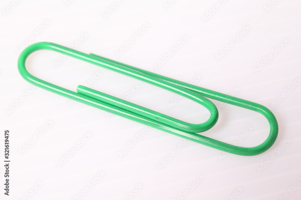 Green paper clip isolated on white Green paper clip isolated on white