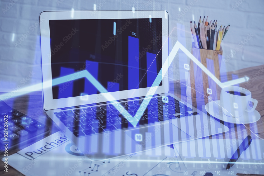 Stock market graph on background with desk and personal computer. Double exposure. Concept of financial analysis. Stock market graph on background with desk and personal computer. Double exposure. Concept of financial analysis.