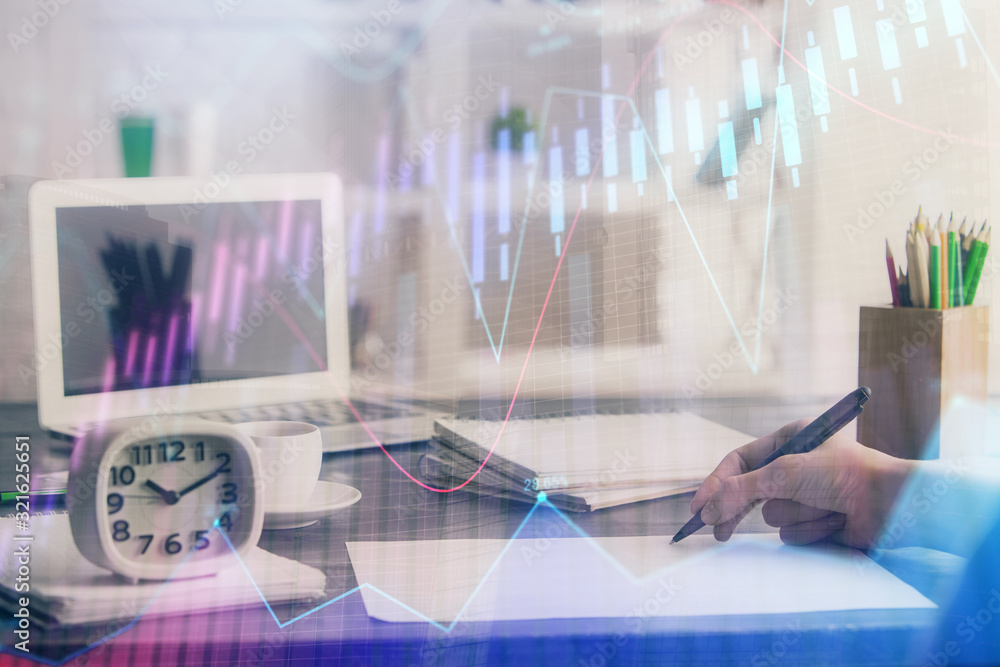 Financial graph displayed on woman's hand taking notes background. Concept of research. Multi exposure Financial graph displayed on woman's hand taking notes background. Concept of research. Multi exposure