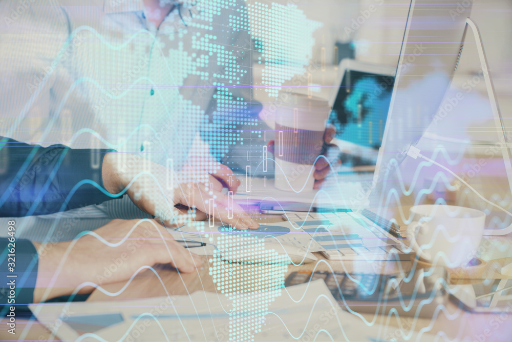 Multi exposure of chart with man typing on computer in office on background. Concept of hard work. Multi exposure of chart with man typing on computer in office on background. Concept of hard work.