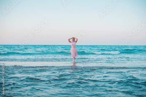 Spring - Summer season. Vacation and travelling time. Woman at sea, pretty nice view 