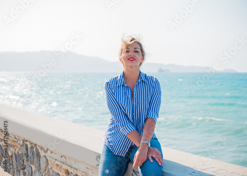 Spring - Summer season. Vacation and travelling time. Woman at sea, pretty nice view  photo