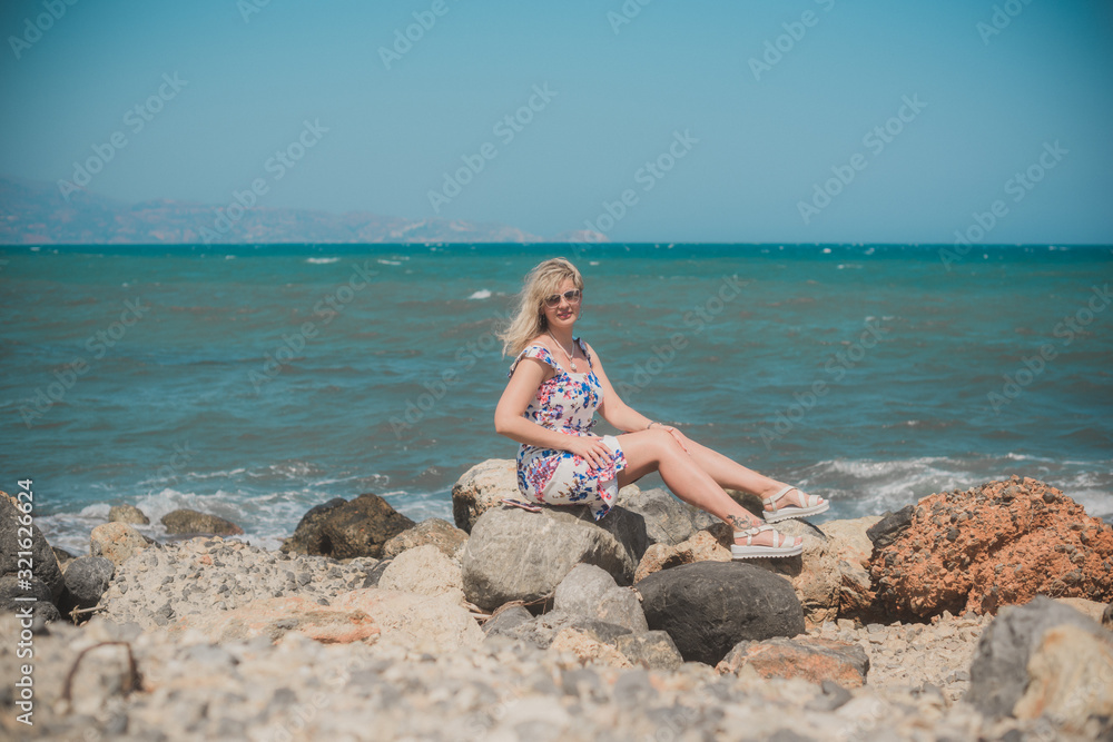 Spring - Summer season. Vacation and travelling time. Woman at sea, pretty nice view 