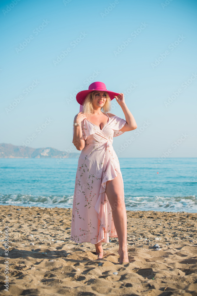 Spring - Summer season. Vacation and travelling time. Woman at sea, pretty nice view Spring - Summer season. Vacation and travelling time. Woman at sea, pretty nice view