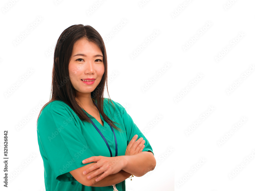 young beautiful and happy Asian Chinese medicine doctor woman or hospital nurse in green scrubs posing cheerful smiling confident in corporate clinic staff portrait