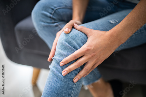 Woman Suffering From Knee Pain