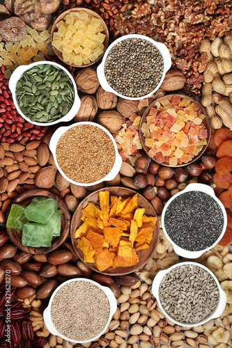 Dried fruit seed and nut collection forming a background. Health food high in antioxidants, protein, omega 3. minerals, vitamins and anthocyanins. Flat lay.