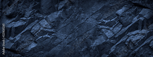 Dark blue grunge background. Deep blue stone background. Toned mountain textu...