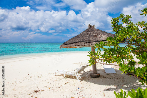Umbrella, Water and Beach Relax View on Maldive Coast © Kisika