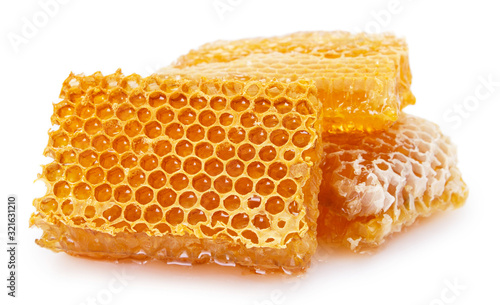 Honeycomb with honey on white background