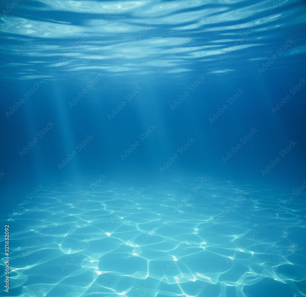 Fototapeta Underwater empty swimming pool background with copy space