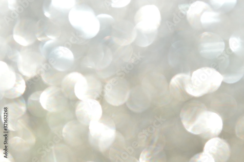 Abstract glittering sheet bokeh reflected in sunlight