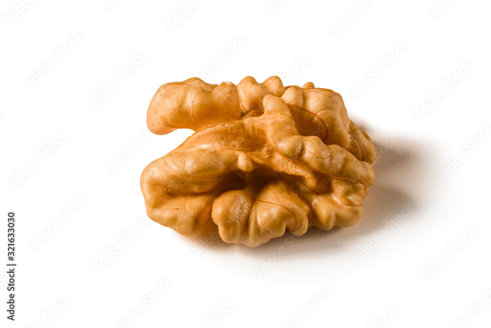 Still life with a walnut peeled on white background. Still life with a walnut peeled on white background.