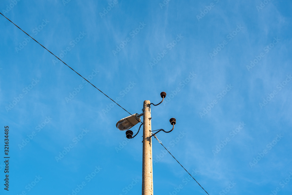 Electric pole telephone cable post sky blue clouds copy space Electric pole telephone cable post sky blue clouds copy space
