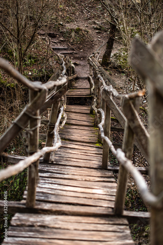 Winding wooden bridge over a river broken symmetry natural explore travel copy space