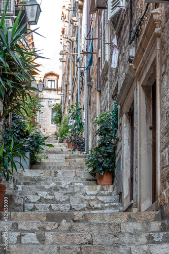 Fototapeta Naklejka Na Ścianę i Meble -  Ancient street stair way perspective in old town of Dubrovnik
