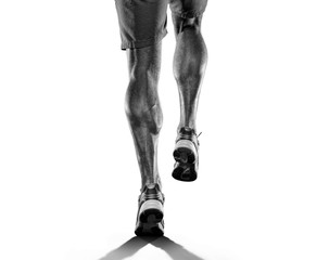 Close up of runners legs isolated on white background