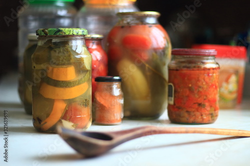 jars of pickles tomatoes and cucumbers