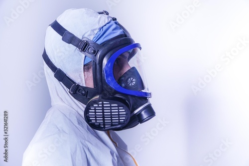 female doctor in protective suit and gas mask