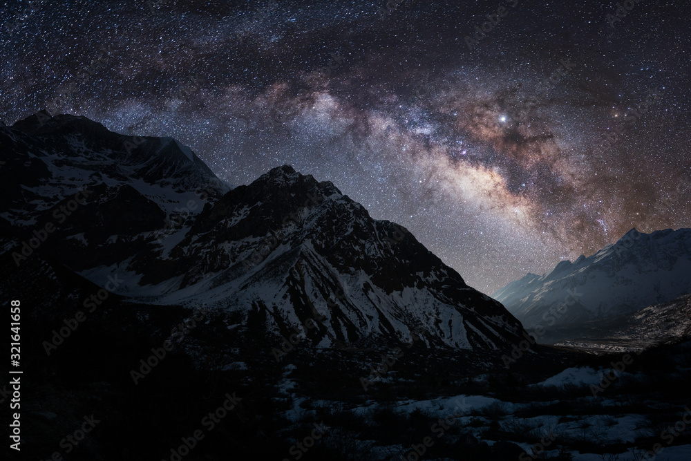 Night landscape of Himalayas with the colorful Milky Way full of stars. Manaslu trek in Nepal.