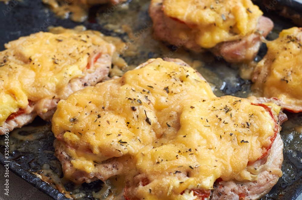 chicken fillet baked in the oven with cheese and tomatoes chicken fillet baked in the oven with cheese and tomatoes