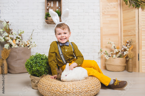 Boy with a rabbit photo