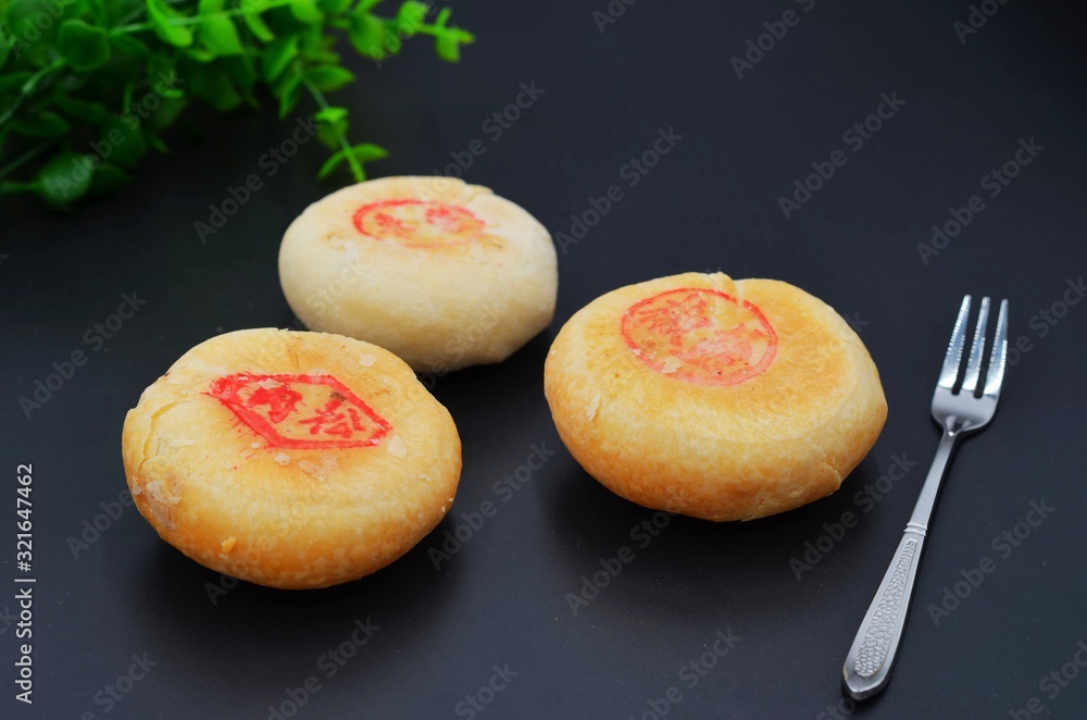 Traditional Chinese food moon cake on black background