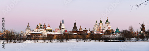 Photography winter frosty morning with a view of the lake and the ancient fortress through a