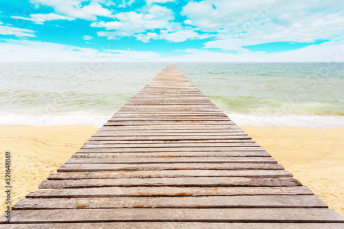 Wooden jetty at beach on daylight