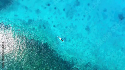 Aerial view of the tropical sea and the beach on a sunny summer day