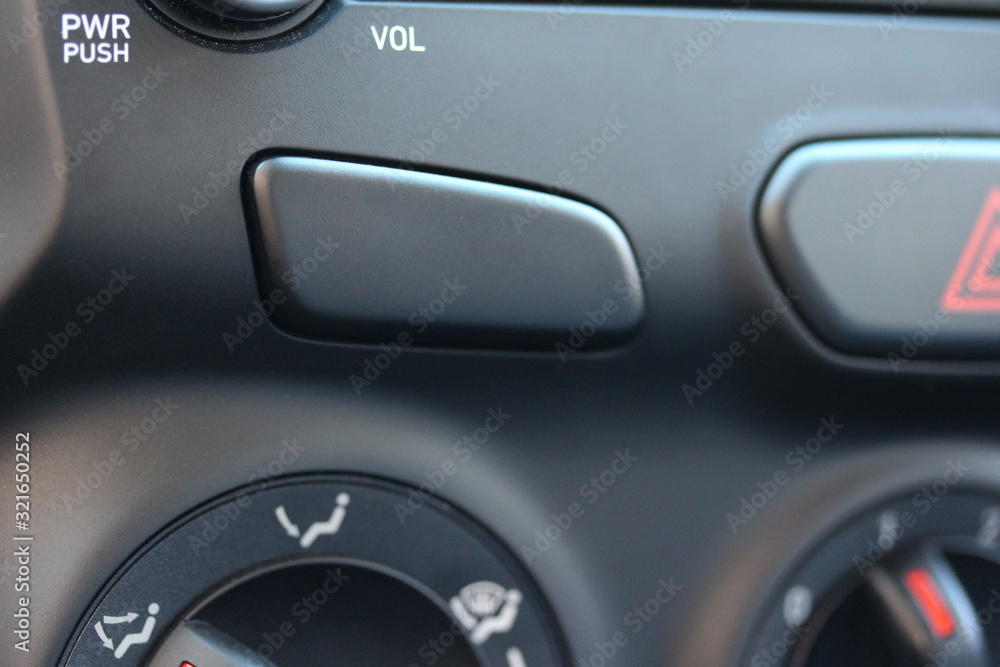 Blank button on vehicle dashboard Blank button on vehicle dashboard