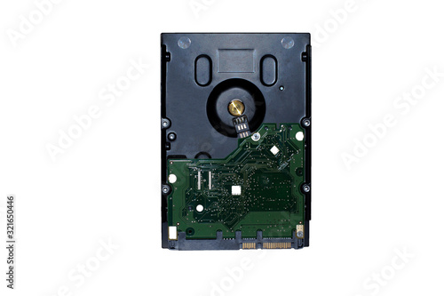 A isolated black hard drive with green circuit board