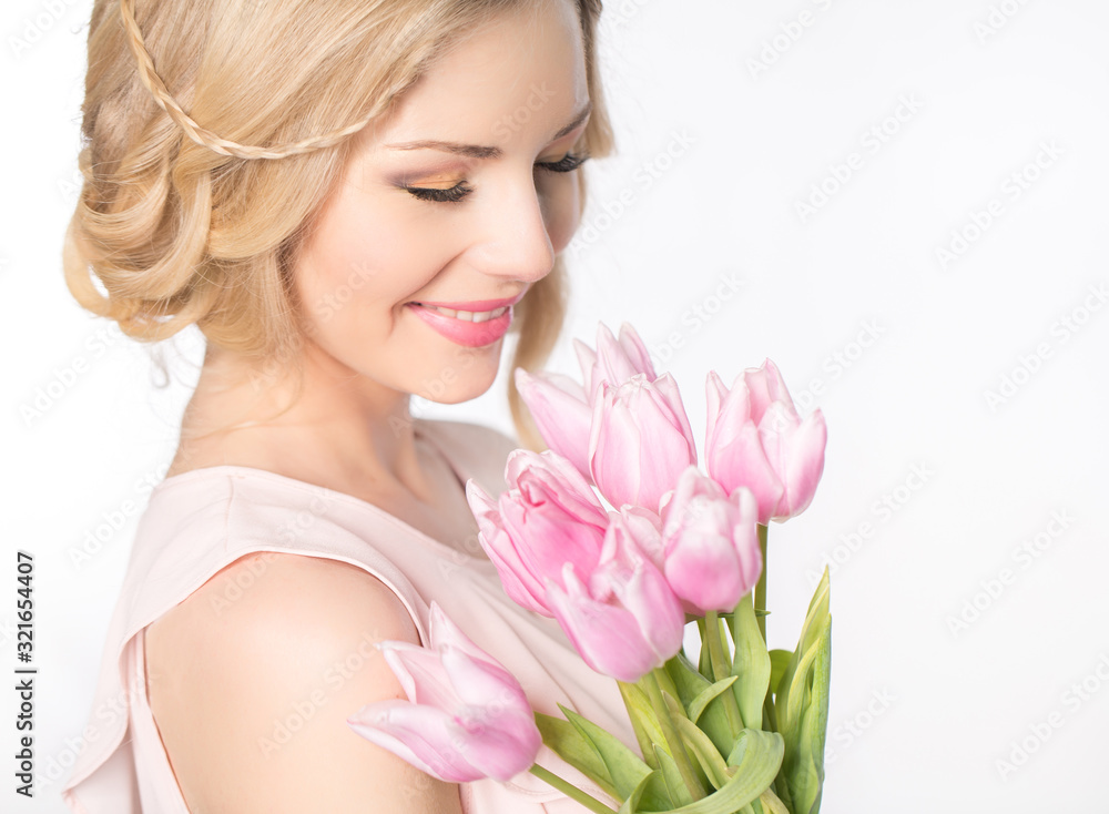Luxurious blonde with a bouquet of tulips Luxurious blonde with a bouquet of tulips