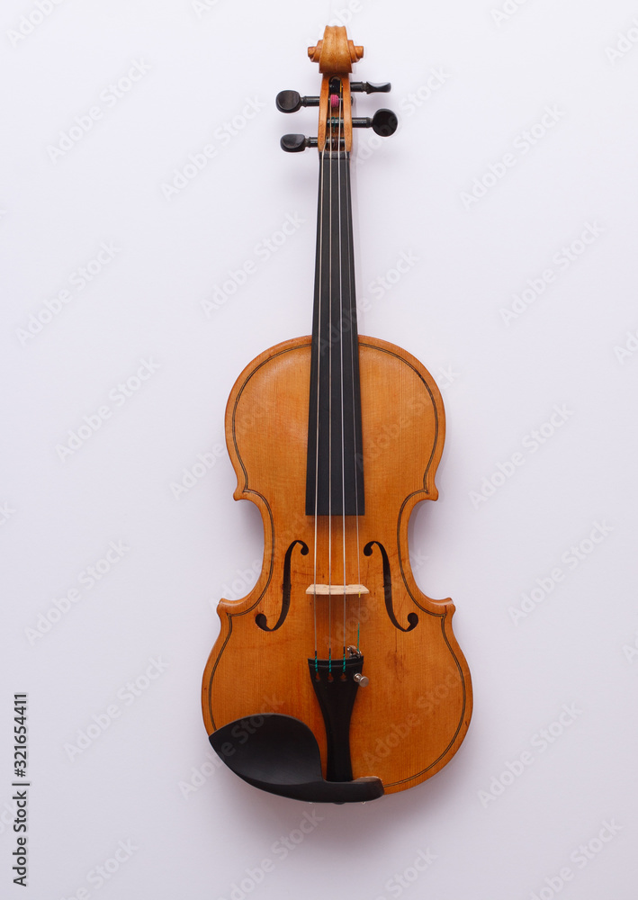 Fototapeta premium Nice golden violin on white background with copyspace for you text