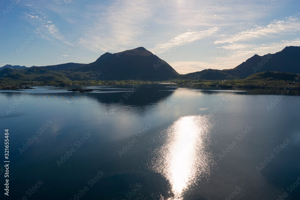 Fototapeta premium Panorama Lofoten is an archipelago in the county of Nordland, Norway. Is known for a distinctive scenery with dramatic mountains and peaks, open sea and sheltered bays, beaches and untouched lands.