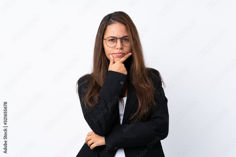 Young Brazilian girl with blazer over isolated white background thinking an idea Young Brazilian girl with blazer over isolated white background thinking an idea
