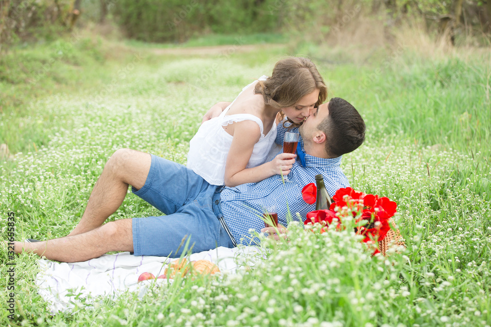 Fototapeta premium Young couple in the spring park