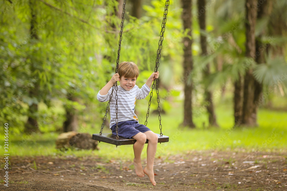 Teen boy on swing