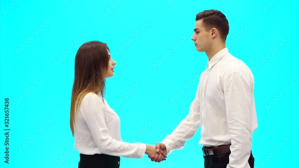 Acquaintance of two business people, on azure blue background. Close up. Copy space. 4K. Acquaintance of two business people, on azure blue background. Close up. Copy space. 4K.