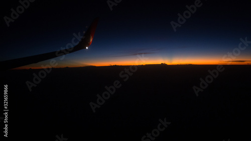 Blurred abstract background of high angle views from the plane window,can see the natural atmosphere during the air travel (mountains,rivers,morning light)